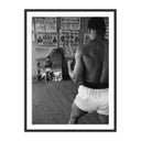 CASSIUS CLAY WATCHING HIMSELF IN A MIRROR