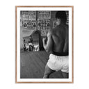 CASSIUS CLAY WATCHING HIMSELF IN A MIRROR
