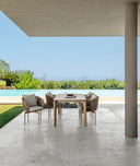 Frame Swivel Dining Armchair by Talenti, outdoor setting