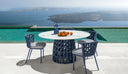 Swipe Round Dining Table by Talenti, outdoor setting