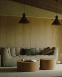 Matho Home luxury interior design featuring sculptural olive-green seating with curved cushions and textured upholstery.